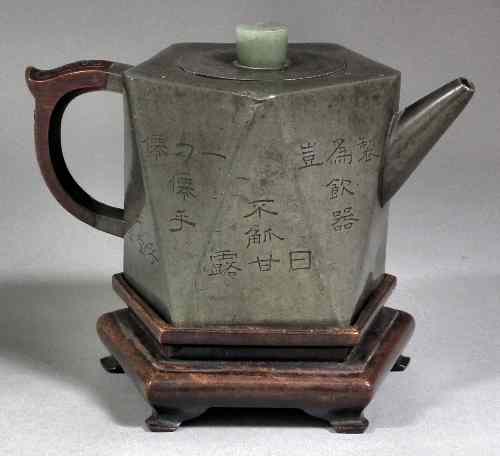 Appraisal: A th Century Chinese pewter ten sided teapot with incised