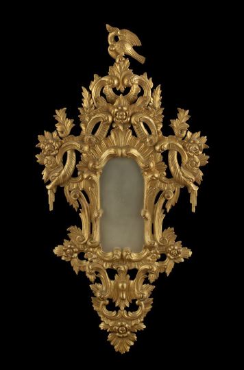 Appraisal: Large and Exuberantly Modeled Italian Carved Giltwood Looking Glass of