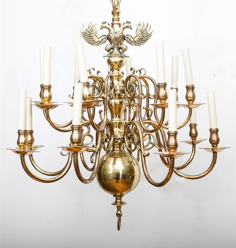 Appraisal: Continental Baroque-Style Brass Twelve-Light Chandelier Surmounted by addorsed eagle crest