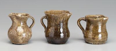 Appraisal: Three alkaline glaze pitchers one attributed to Cheever Meaders White