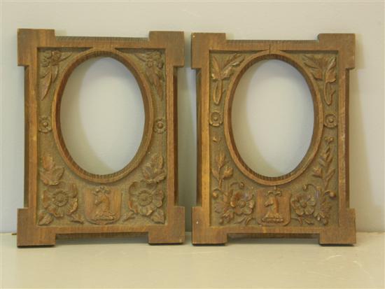 Appraisal: Pair of th Century oak carved oval picture frames h