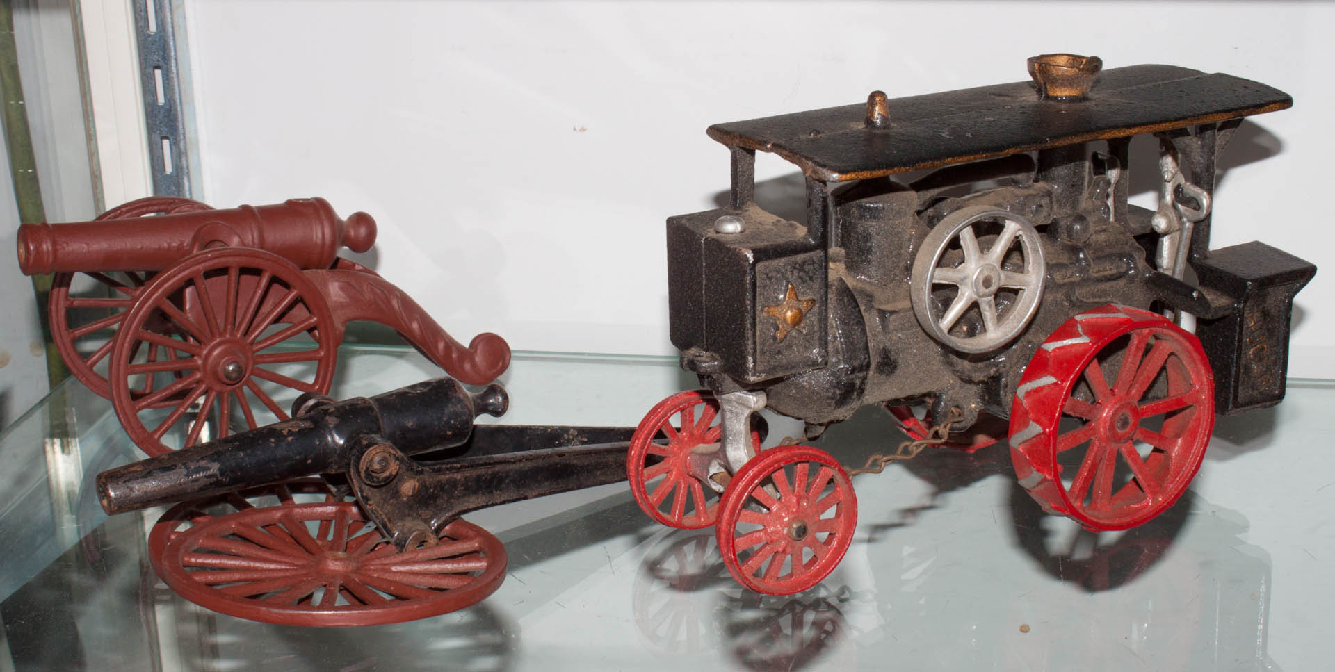 Appraisal: Cast iron traction engine two cannons Condition One cannon missing