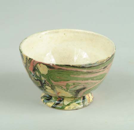 Appraisal: SMALL POTTERY BOWL With unusual colorful marble or scroddle-type decoration