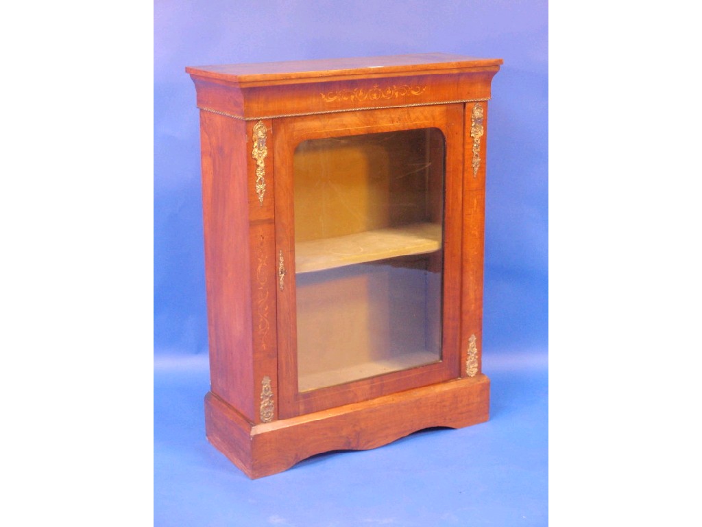 Appraisal: A Victorian walnut pier cabinet with single glazed door enclosed