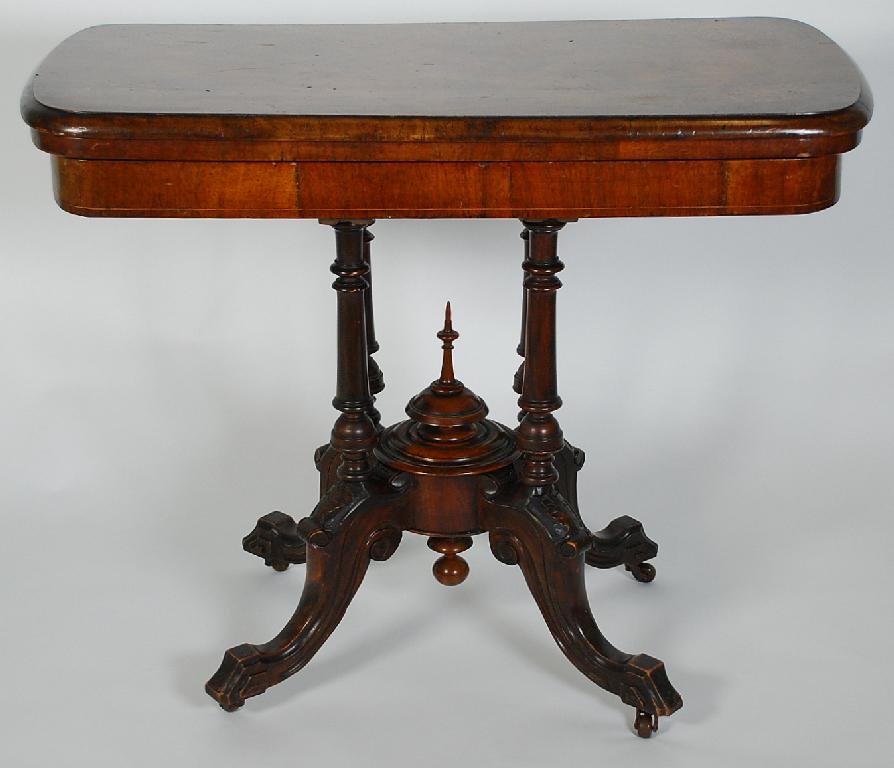 Appraisal: VICTORIAN INLAID WALNUT PEDESTAL CARD TABLE the quarter veneered rounded