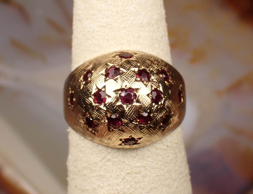 Appraisal: RUBY AND FOURTEEN KARAT YELLOW GOLD DOME RING set with