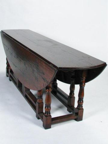 Appraisal: th century oak Scottish wake table double-gateleg double drop-leaf turned