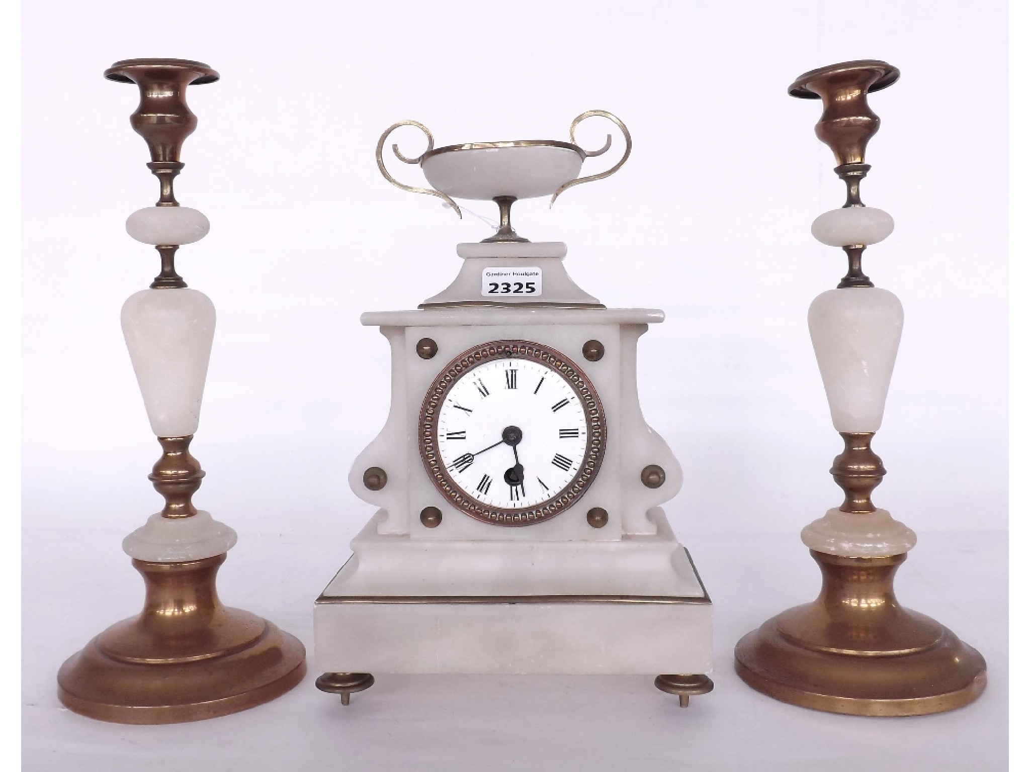 Appraisal: White onyx and brass mounted single train mantel clock garniture