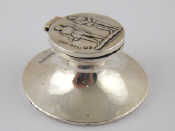 Appraisal: A small capstan inkwell the lid embossed with a bowman