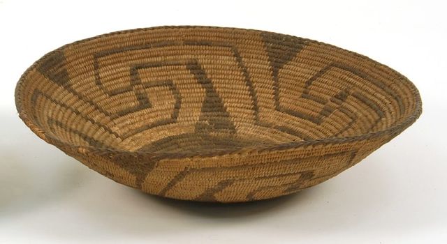 Appraisal: AMERICAN INDIAN COIL BASKET With repetitive bicolor geometric design Diameter