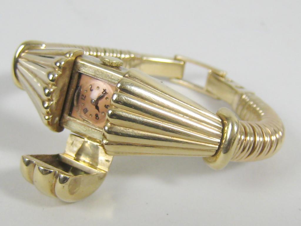 Appraisal: A 's Lady's Wristwatch Bracelet the square bronzed dial hidden