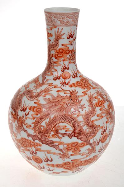 Appraisal: CHINESE IRON RED DECORATED BOTTLE VASE WITH REPEATING DRAGON SCENE