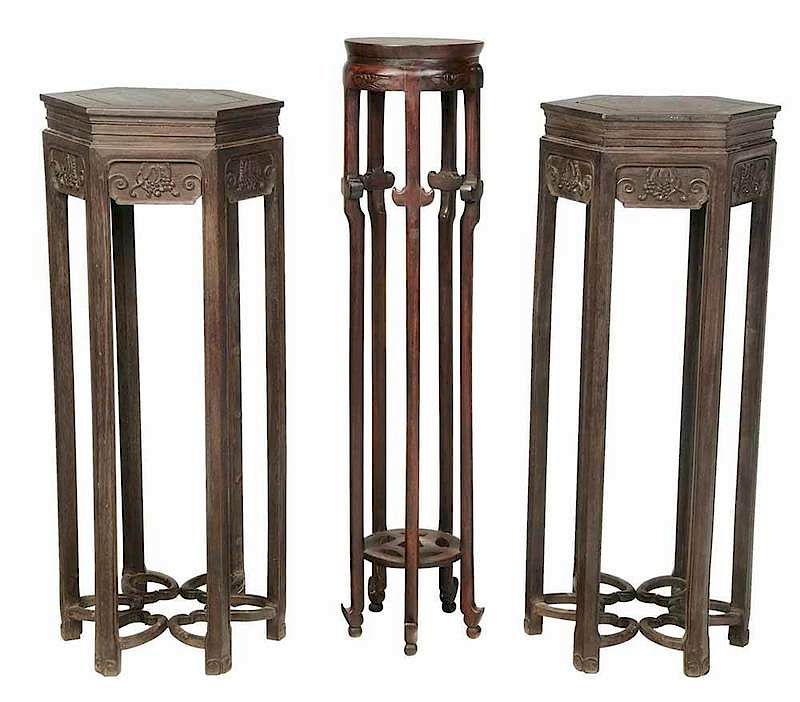 Appraisal: Three Carved Hardwood Urn Stands Chinese early th century pair