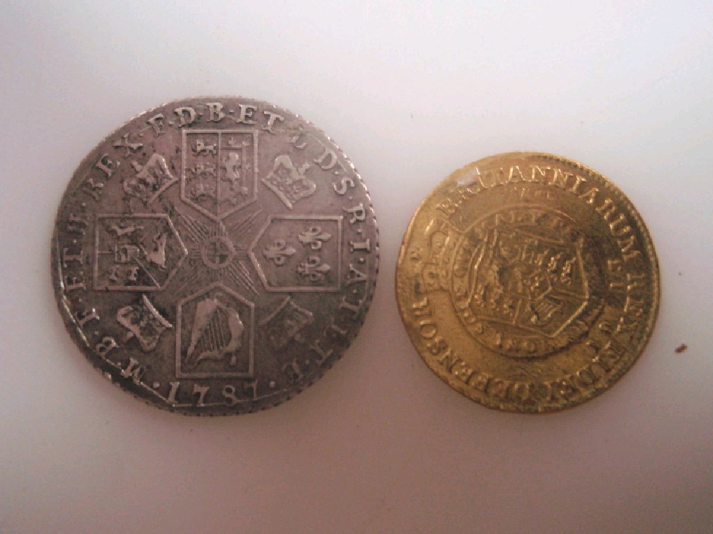 Appraisal: A George III half crown and an guinea possibly sand