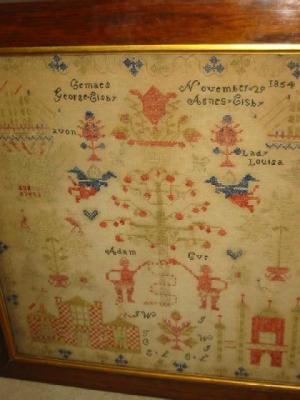 Appraisal: A VICTORIAN SAMPLER featuring Adam and Eve amongst angels birds