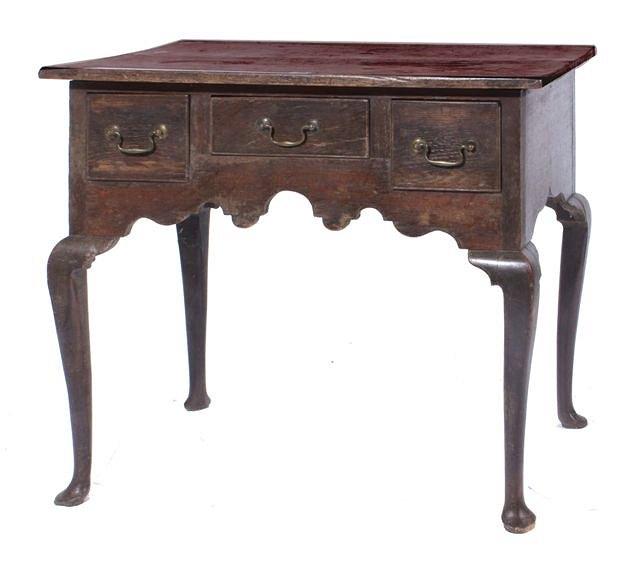 Appraisal: A George III oak lowboy wide x high