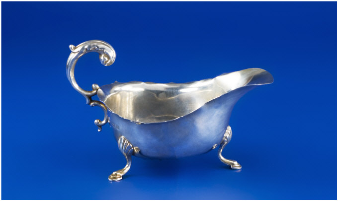 Appraisal: Silver Cream Jug With scroll handle raised on hoof feet