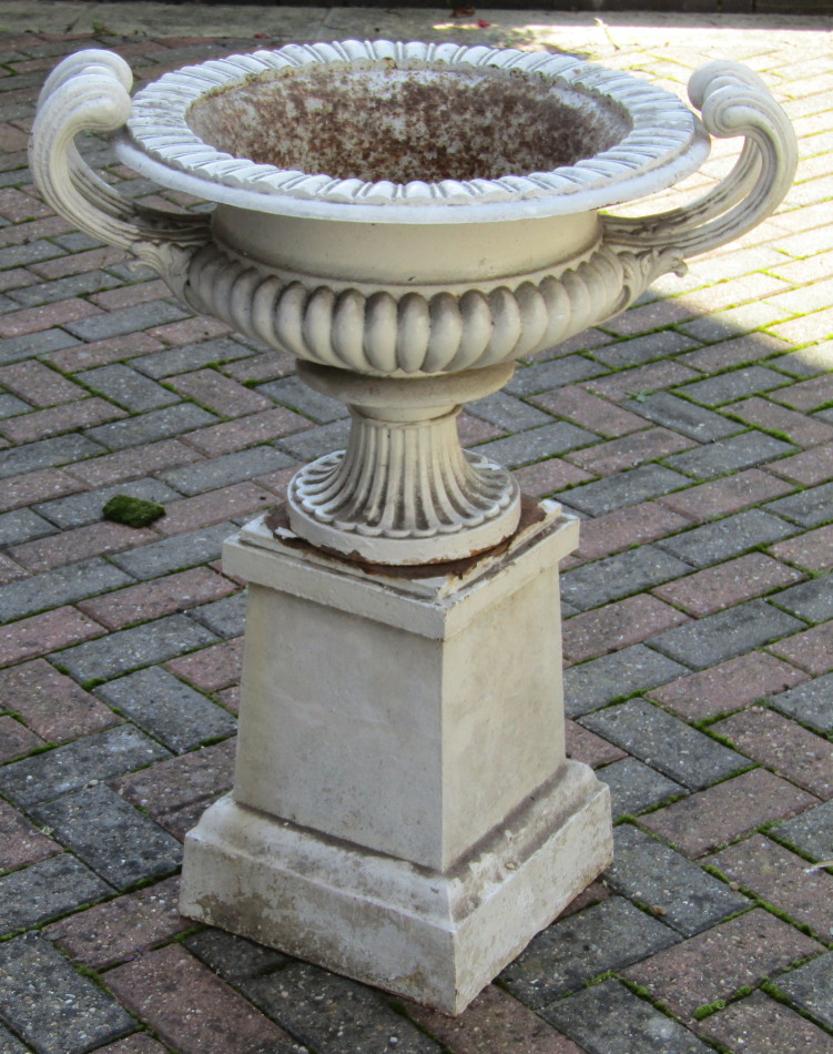 Appraisal: A Victorian cast iron garden urn of compressed campana form