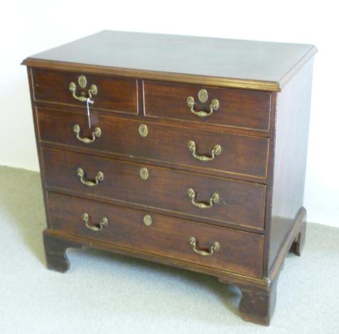 Appraisal: AN EARLY GEORGE III MAHOGANY CHEST of two short and