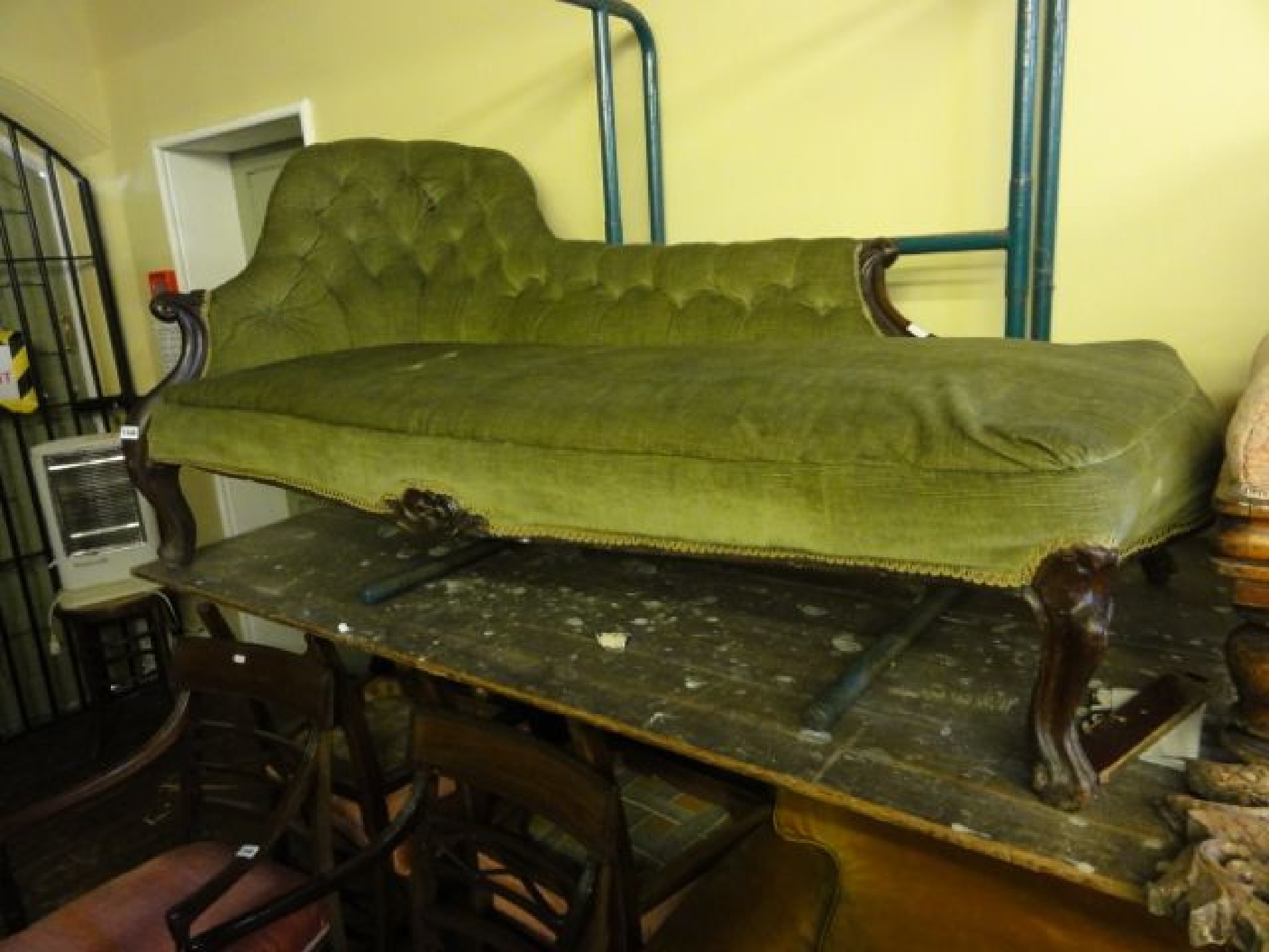 Appraisal: A Victorian chaise lounge with upholstered and button back raised