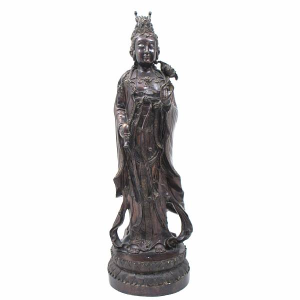 Appraisal: A Chinese style patinated cast metal standing Guan yin height