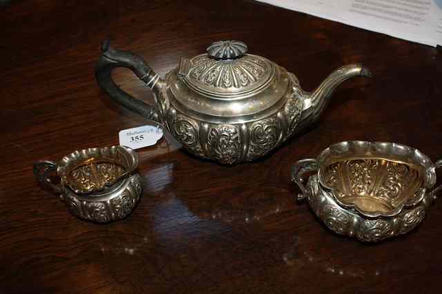 Appraisal: A VICTORIAN SILVER THREE PIECE TEA SET oval shaped teapot