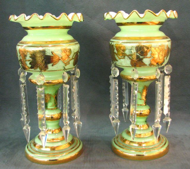 Appraisal: Pair of green and white cased glass hurricane lustres with