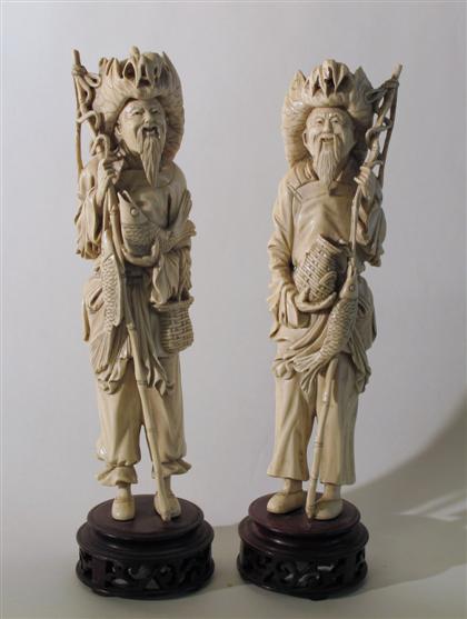 Appraisal: Pair of Chinese carved elephant ivory fisherman figuresTall male figures