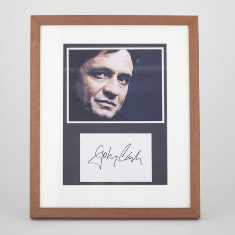 Appraisal: Johnny Cash Autograph late th century framed with photograph portrait