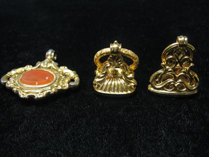 Appraisal: Three gold stamps One with bloodstone another with orange stone