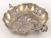 Appraisal: A white metal tests silver sweetmeats dish lobed and embossed