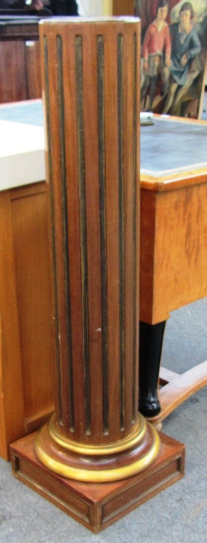 Appraisal: A pair of th century parcel gilt fluted mahogany columns