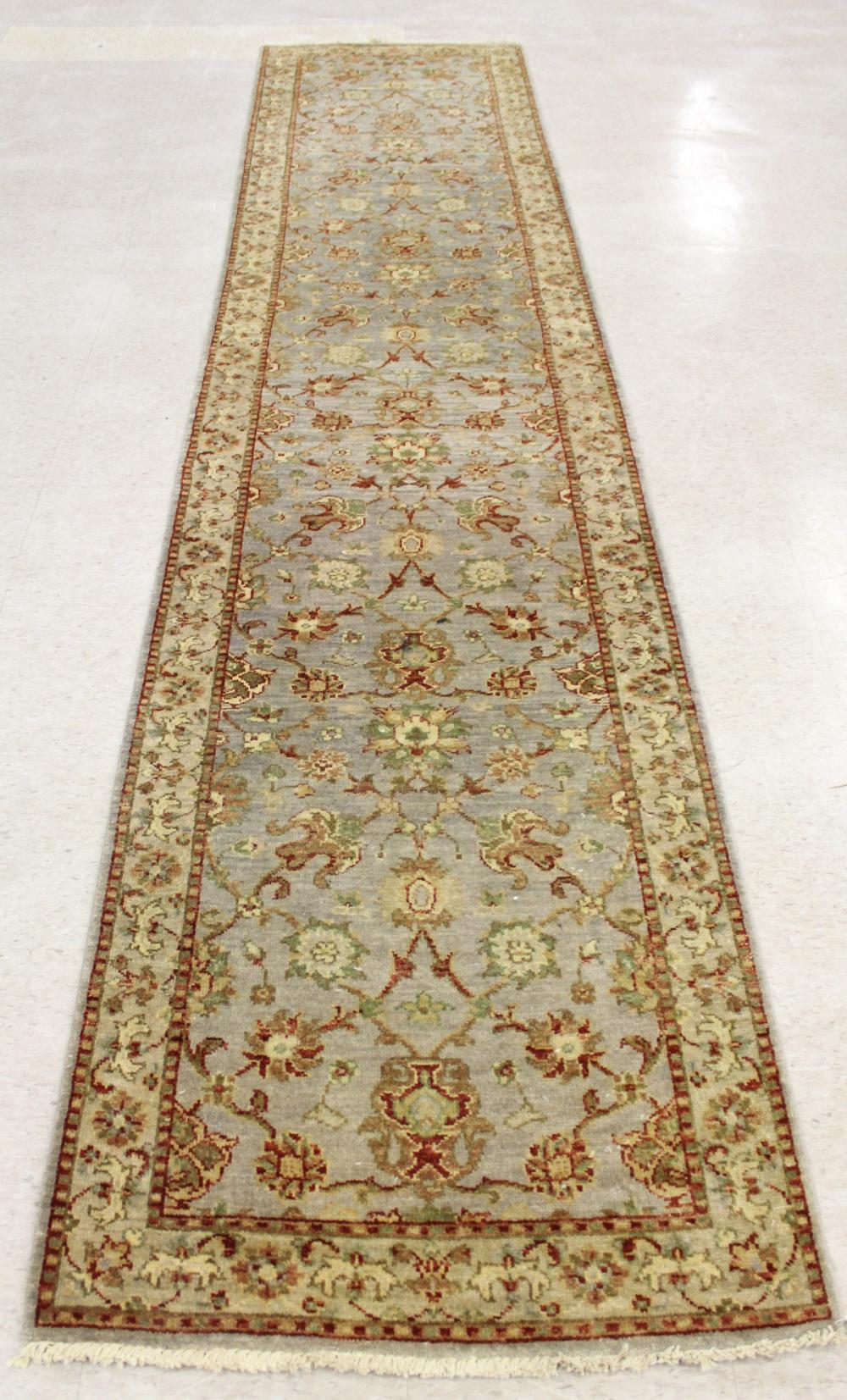 Appraisal: HAND KNOTTED ORIENTAL RUNNER Pakistani-Persian floral design ' x '