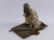 Appraisal: An Austrian cold painted bronze of an Arab carpet vendor