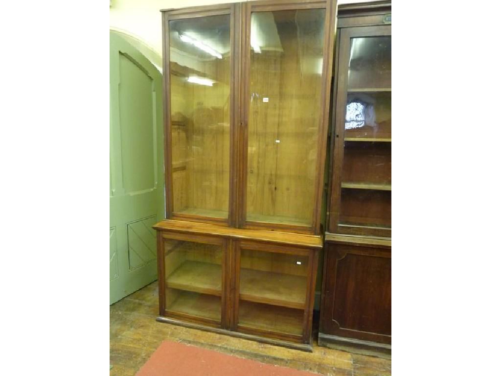 Appraisal: An Edwardian mahogany library bookcase enclosed by two pairs of