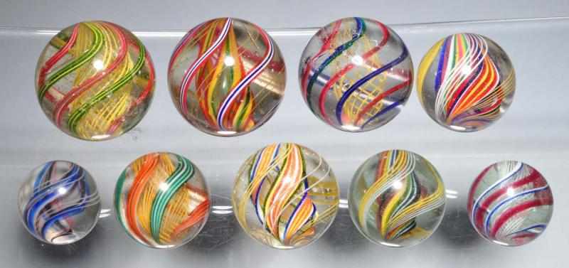 Appraisal: Lot of Multi-Color Swirl Marbles Description Includes three yellow latticino