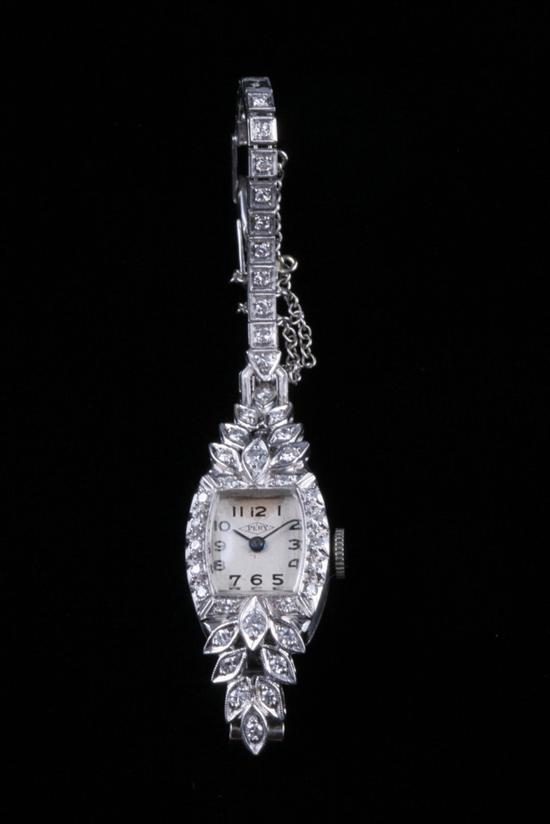 Appraisal: LADY'S PLATINUM AND DIAMOND EVENING WATCH by Perry Barrel shape