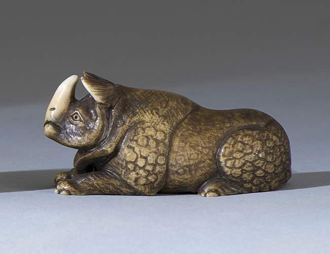 Appraisal: IVORY NETSUKE th CenturyIn the form of a rhinoceros Signed