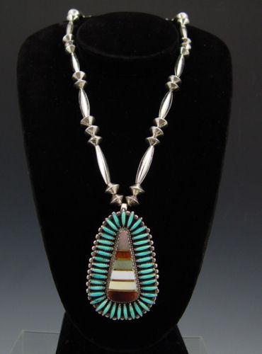 Appraisal: SIGNED ZUNI STERLING NECKLACE Silver pendent centered by inset panel