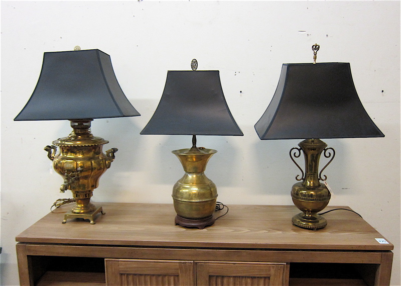 Appraisal: THREE BRASS TABLE LAMPS with matching rectangular black shades featuring