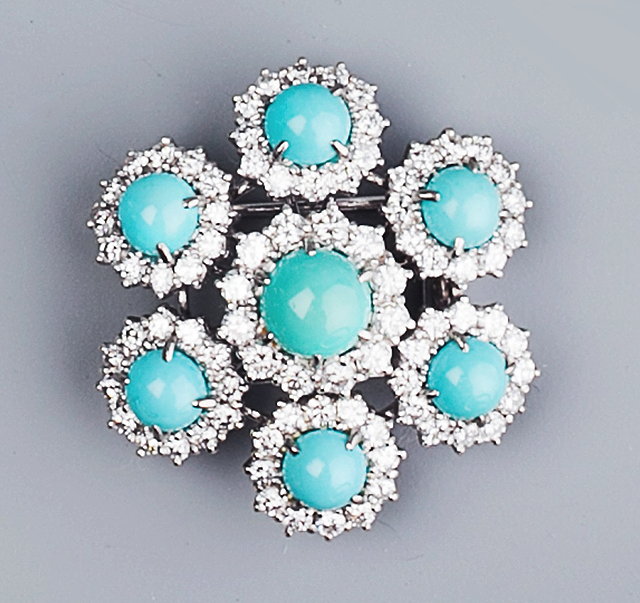 Appraisal: A DIAMOND AND GEM SET CLUSTER BROOCH the central turquoise-coloured