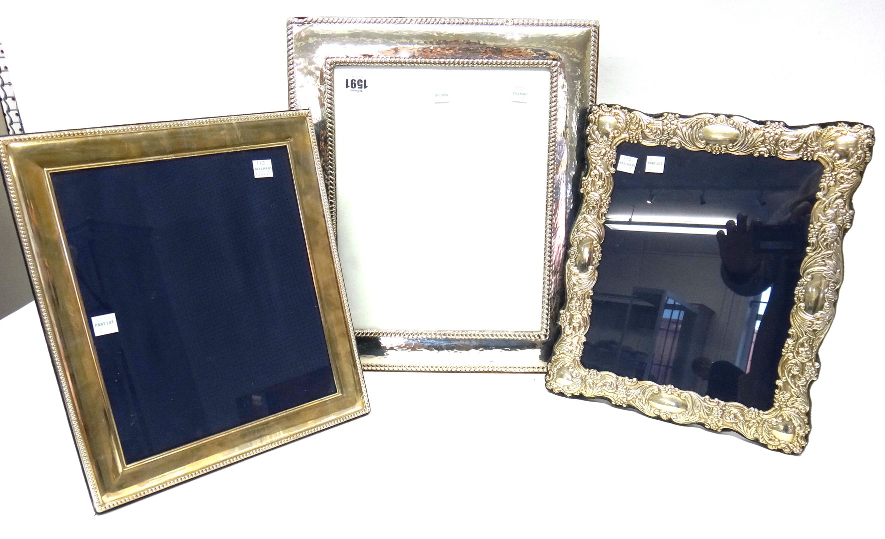 Appraisal: A silver mounted large rectangular photograph frame with decorated borders