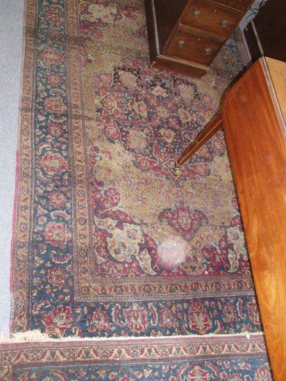 Appraisal: A pair of bordered and figured Teheran rugs of crimson