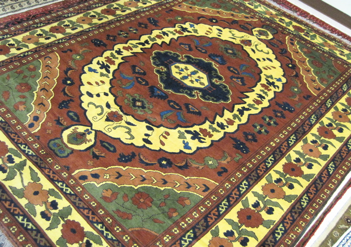 Appraisal: HAND KNOTTED AFGHAN CARPET floral and central floral medallion design