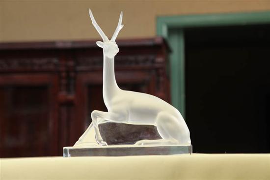 Appraisal: LALIQUE FIGURE Seated frosted glass deer on a clear base