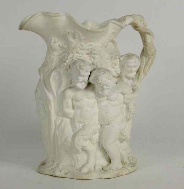 Appraisal: An unglazed relief moulded jug with Bacchanalian scene cm high