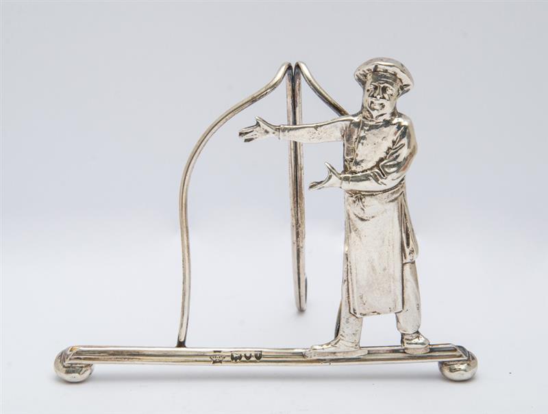 Appraisal: ENGLISH SILVER CHEF-FORM MENU STAND W Hutton Sons Ltd London