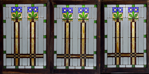 Appraisal: ARTS CRAFTS Three leaded glass windows with stylized blue blossoms