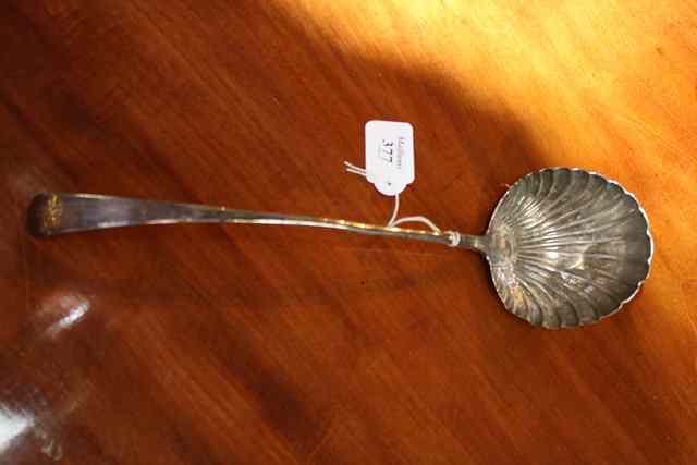 Appraisal: A GEORGE III SILVER SOUP LADLE with scallop shell bowl