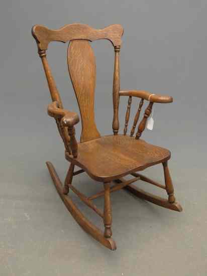 Appraisal: Victorian oak armed rocking chair '' Seat Ht '' Overall